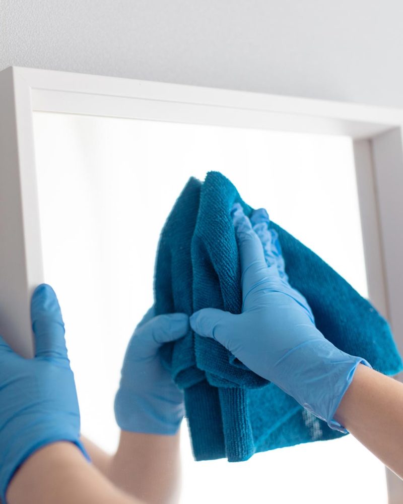 Commercial Cleaning Services cleaning mirror